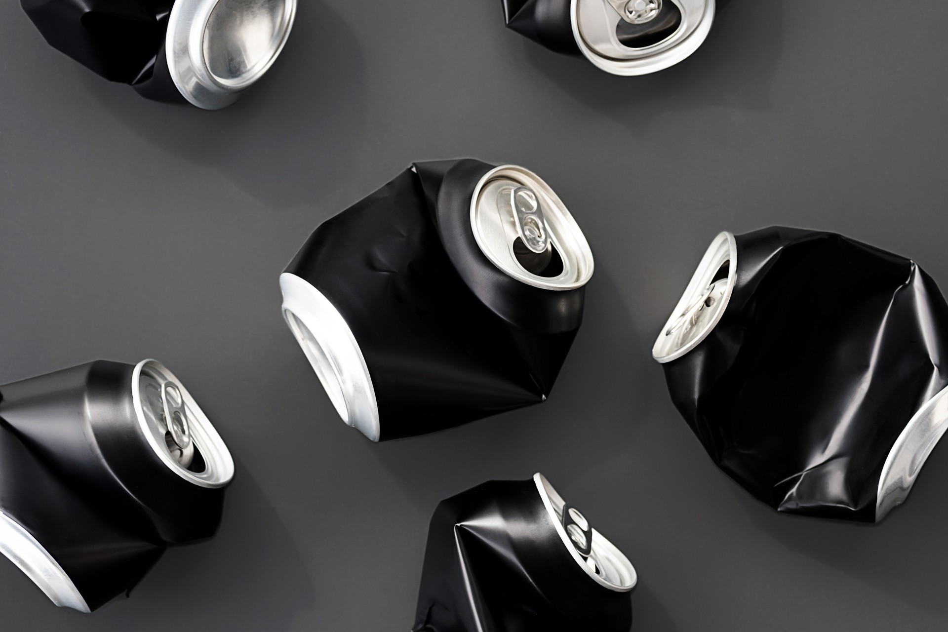 Crumpled aluminum soda cans still life.